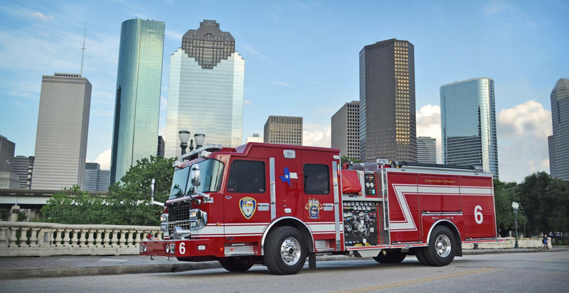hfd truck in front of houston skyline