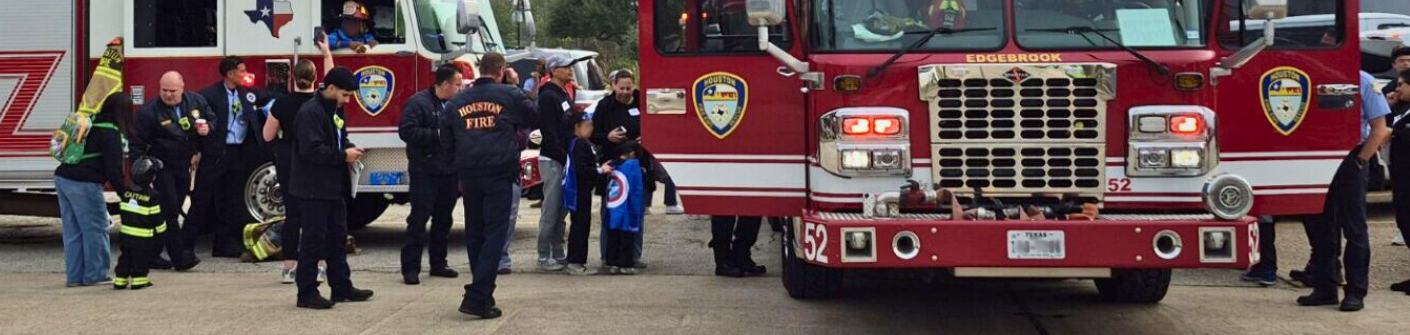 HFD trucks with crowd of people, children, taking photos
