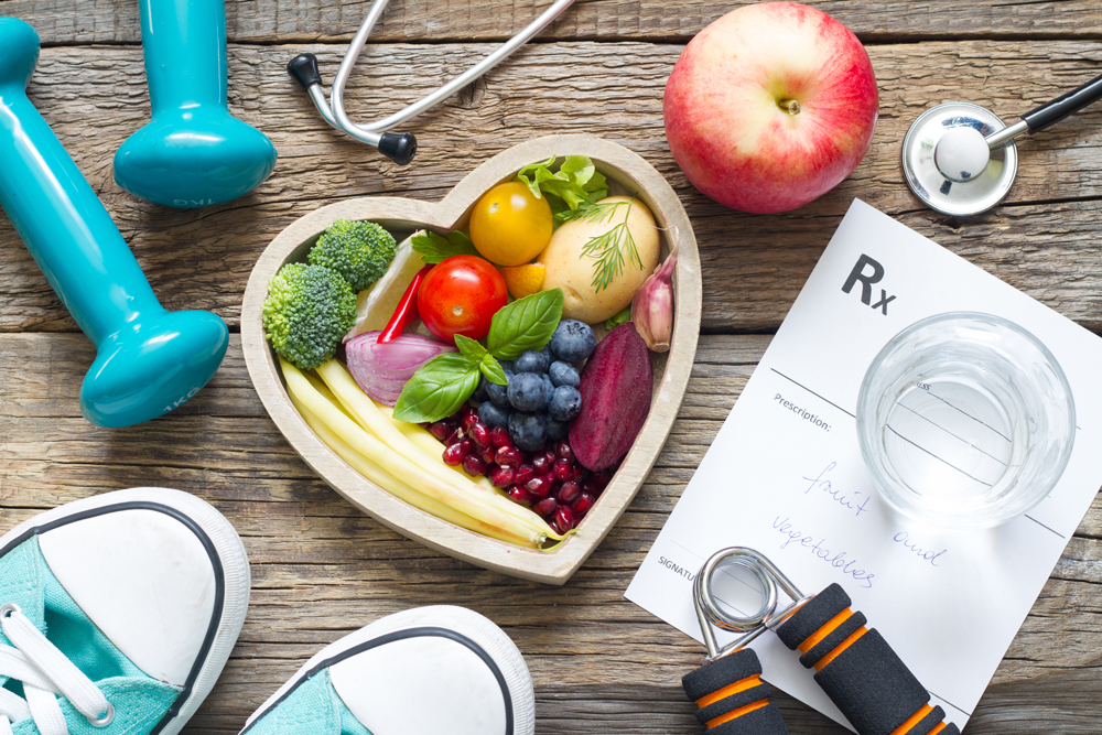 Wellness image of fruits and workout equipment