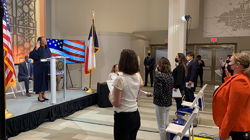 Petitioners take the Oath of Allegiance administered by Presiding Judge Vanessa D. Gilmore