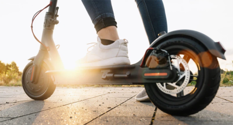 Feet on E-Scooter